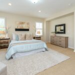 Bright modern bedroom with neutral decor and cozy ambiance, perfect for home decor inspiration.